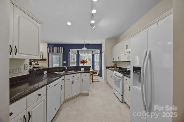 a large kitchen with cabinets