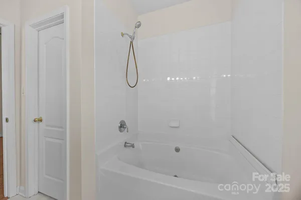 a close up of a bathtub in a bathroom