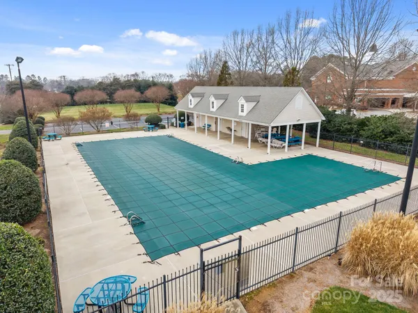 an aerial view of a house with a garden and plants