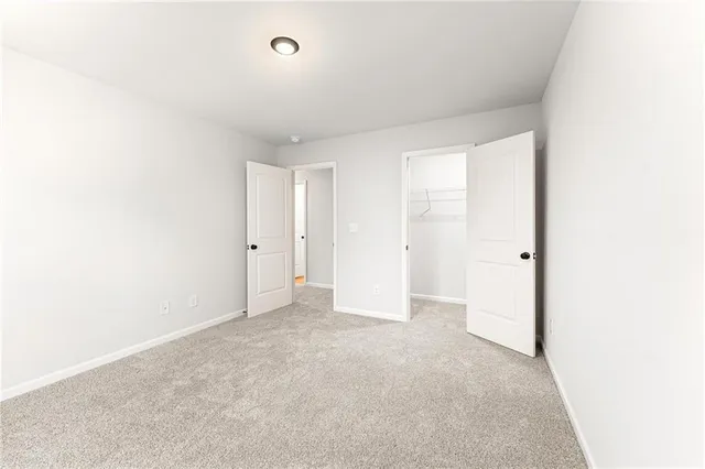 a view of balcony with a floor to ceiling window next to a yard