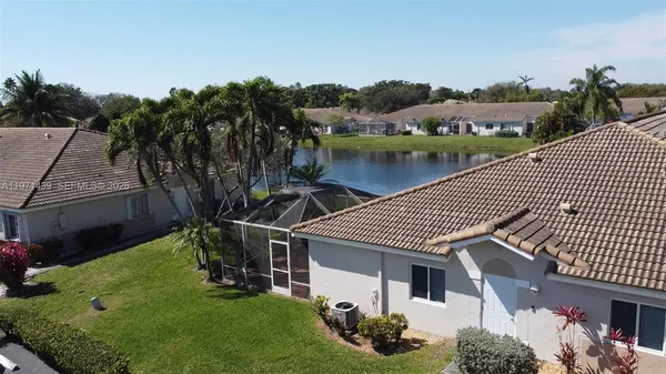 a aerial view of a house with a lake view