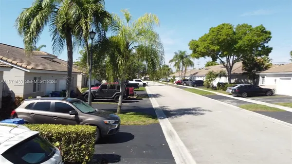 a view of a yard with cars