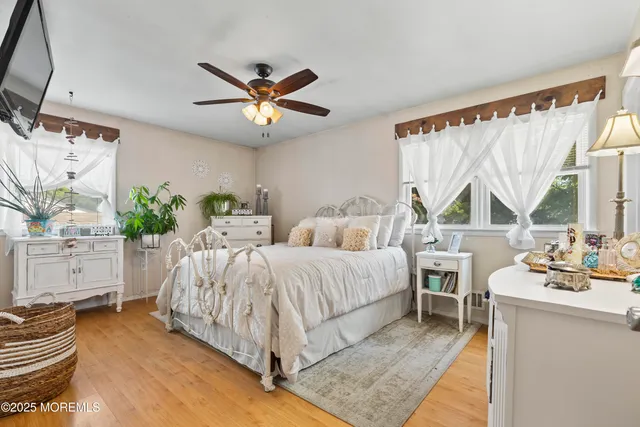 a bed room with a bed and a chandelier