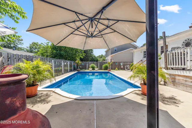 a view of a swimming pool with a patio