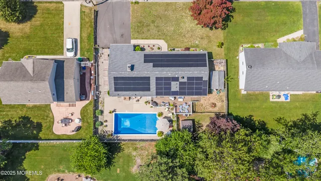 an aerial view of a house with outdoor space