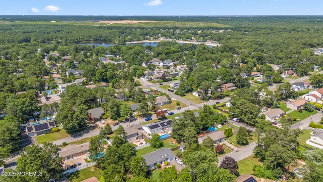 a view of a city with lush green forest