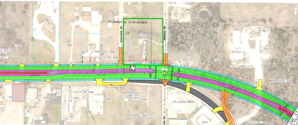 a view of a park with large trees and a wooden bench