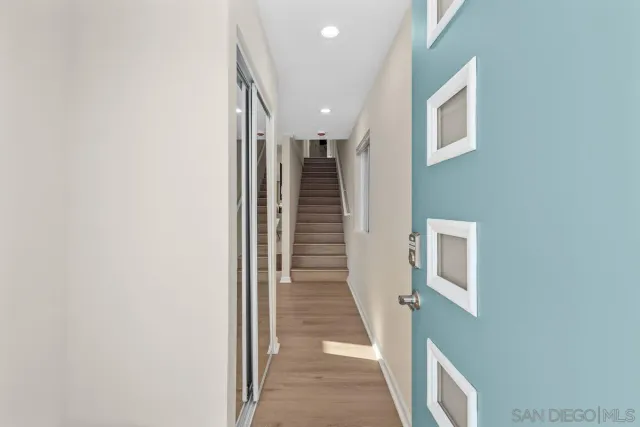 a view of a hallway with staircase
