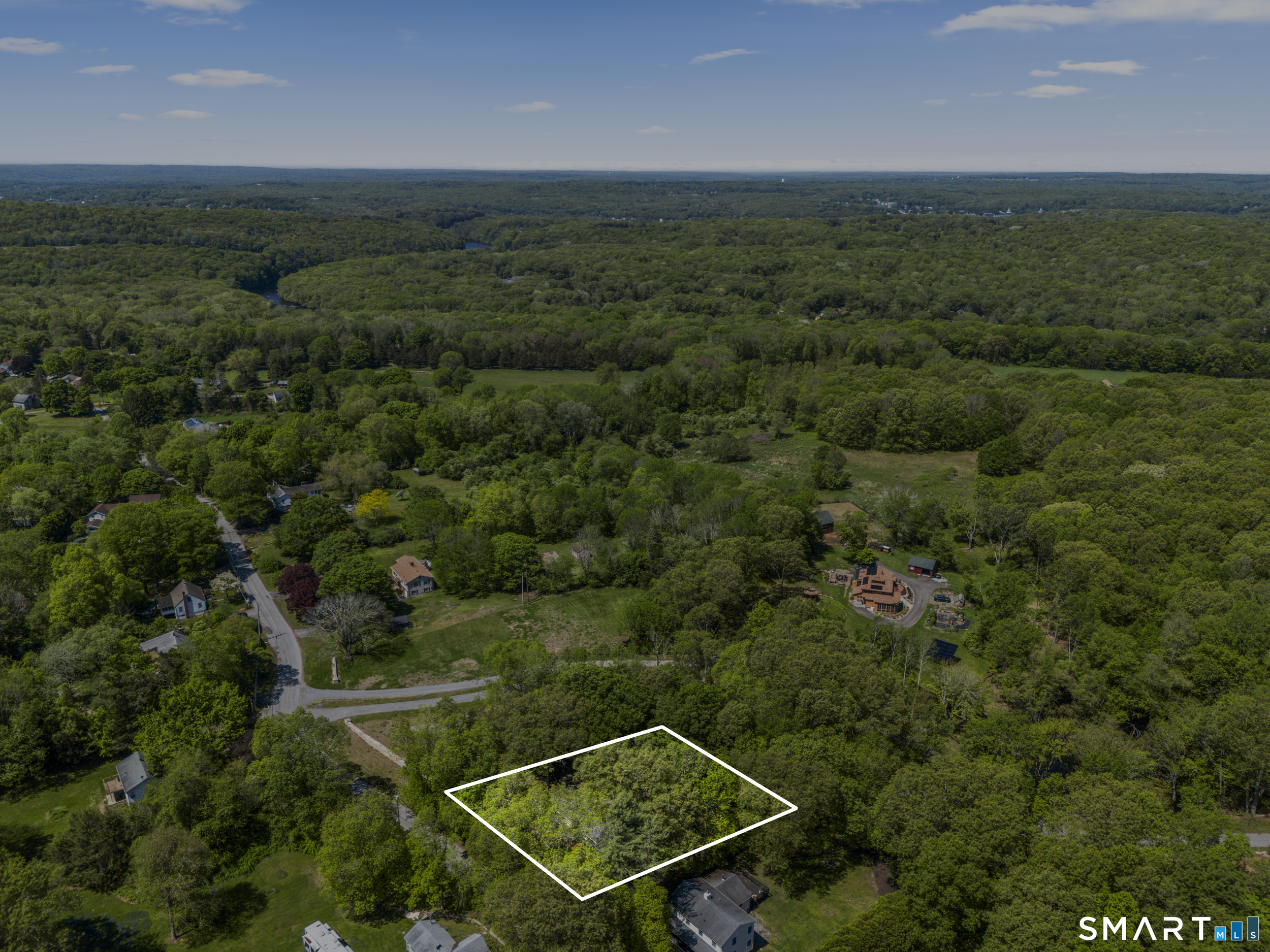 121 River Road Preston, CT 06365 - Photo 37 of 37 an aerial view of a house with a yard