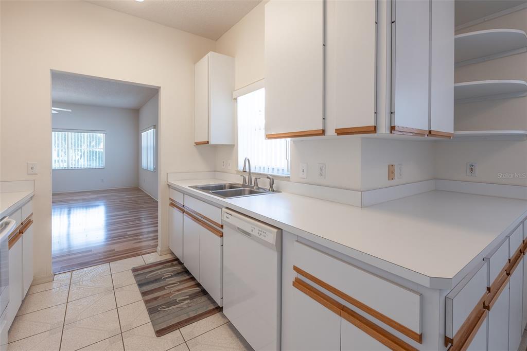 9077 Southwest 95th Terrace Ocala, FL 34481 - Photo 13 of 45 a kitchen with a sink and cabinets