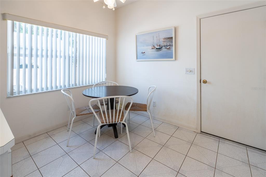 9077 Southwest 95th Terrace Ocala, FL 34481 - Photo 14 of 45 a dining room with furniture and window