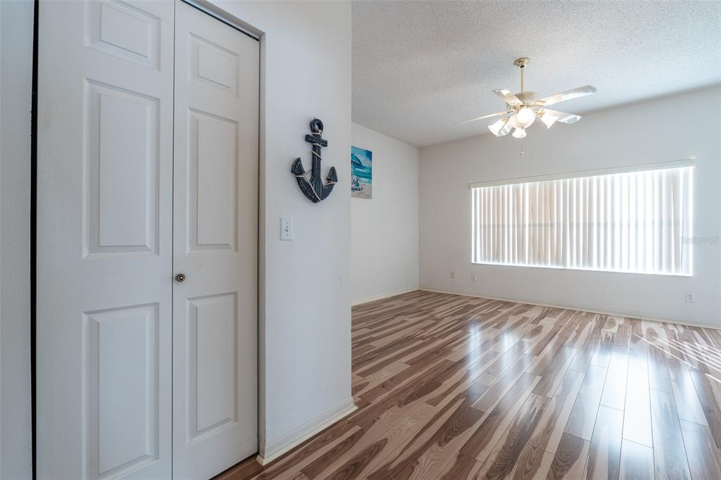 9077 Southwest 95th Terrace Ocala, FL 34481 - Photo 16 of 45 a view of a livingroom with a ceiling fan and window