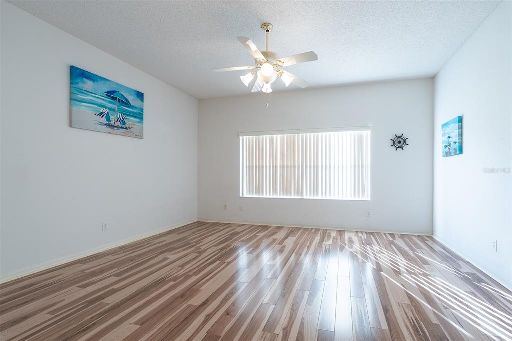 9077 Southwest 95th Terrace Ocala, FL 34481 - Photo 17 of 45 a view of wooden floor and windows in a room