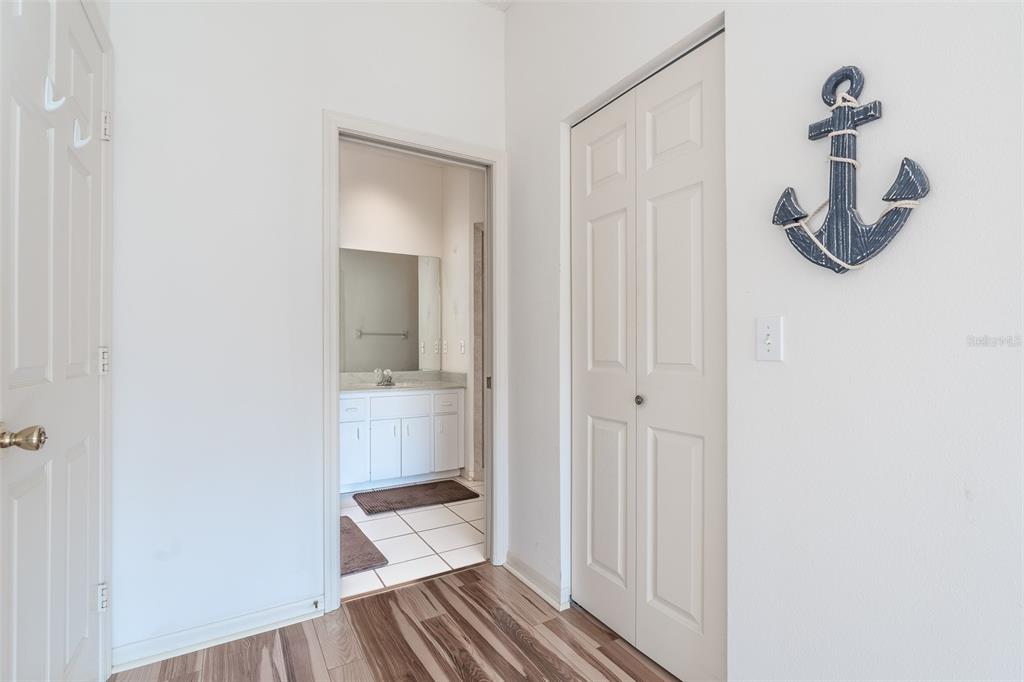 9077 Southwest 95th Terrace Ocala, FL 34481 - Photo 19 of 45 a bathroom with a glass shower door and a sink