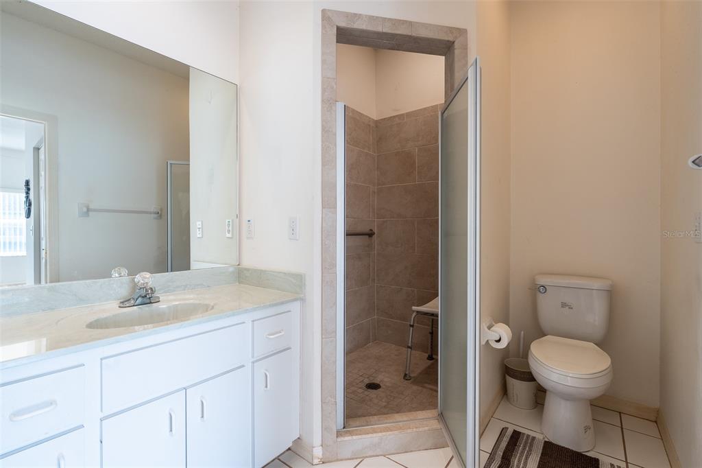 9077 Southwest 95th Terrace Ocala, FL 34481 - Photo 20 of 45 a bathroom with a sink a toilet and shower