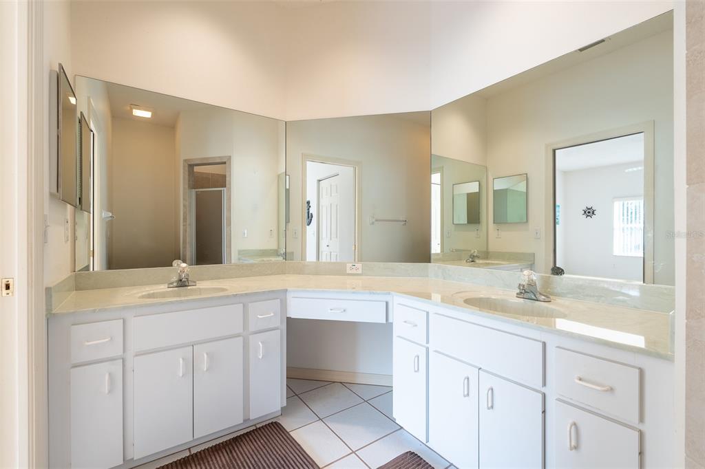 9077 Southwest 95th Terrace Ocala, FL 34481 - Photo 21 of 45 a bathroom with a sink and a mirror