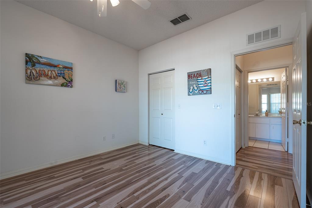9077 Southwest 95th Terrace Ocala, FL 34481 - Photo 26 of 45 wooden floor in an empty room