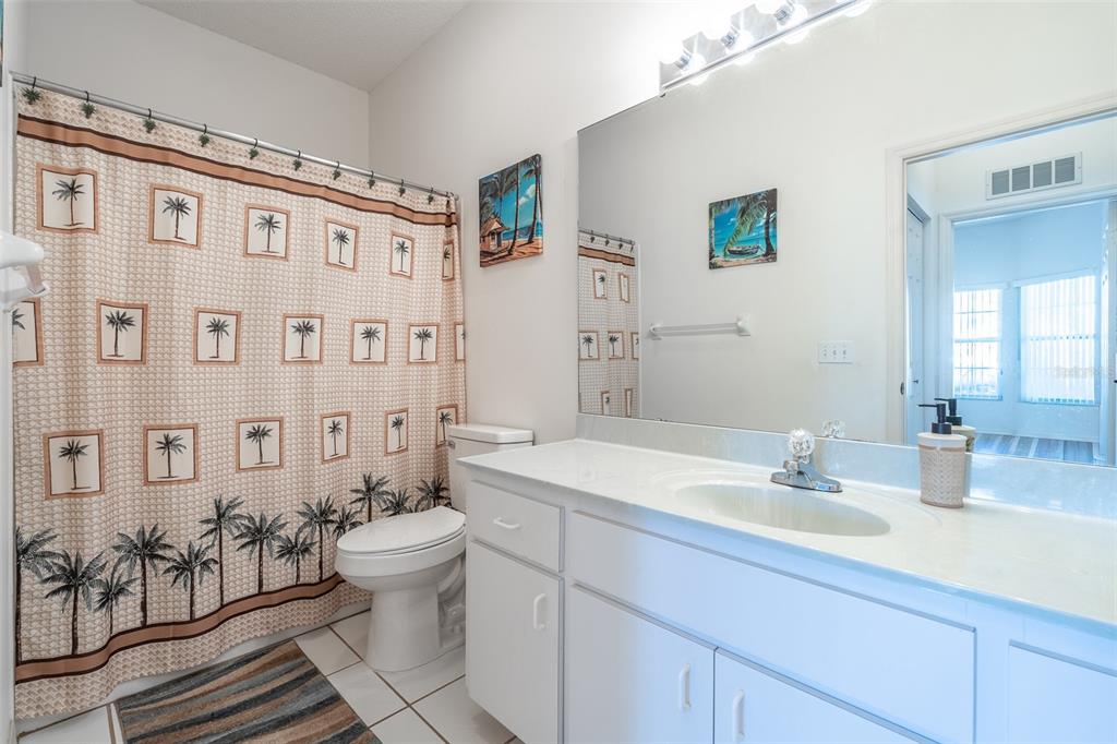 9077 Southwest 95th Terrace Ocala, FL 34481 - Photo 29 of 45 a bathroom with a sink a toilet and shower