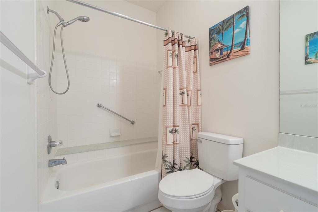 9077 Southwest 95th Terrace Ocala, FL 34481 - Photo 30 of 45 a white toilet sitting next to a bath tub shower