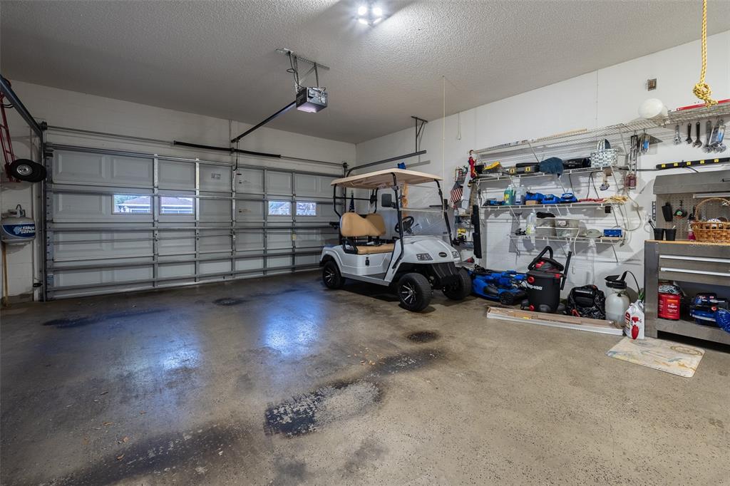 9077 Southwest 95th Terrace Ocala, FL 34481 - Photo 37 of 45 a view of a garage with parked cars