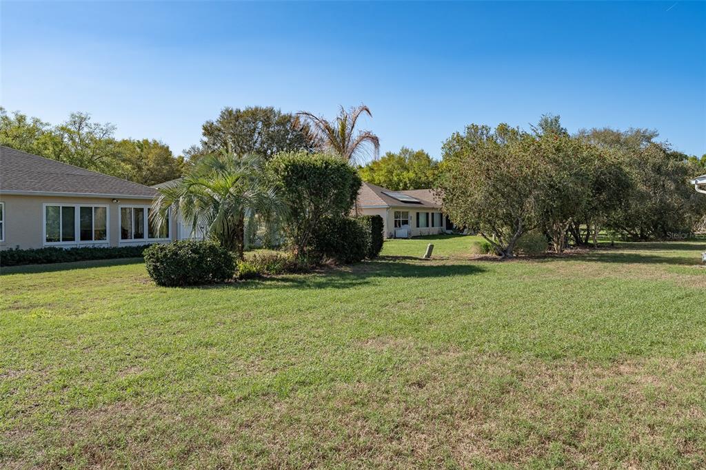 9077 Southwest 95th Terrace Ocala, FL 34481 - Photo 42 of 45 a front view of a house with garden