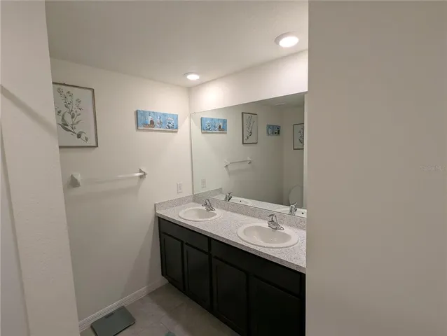 a bathroom with a sink a mirror and a toilet