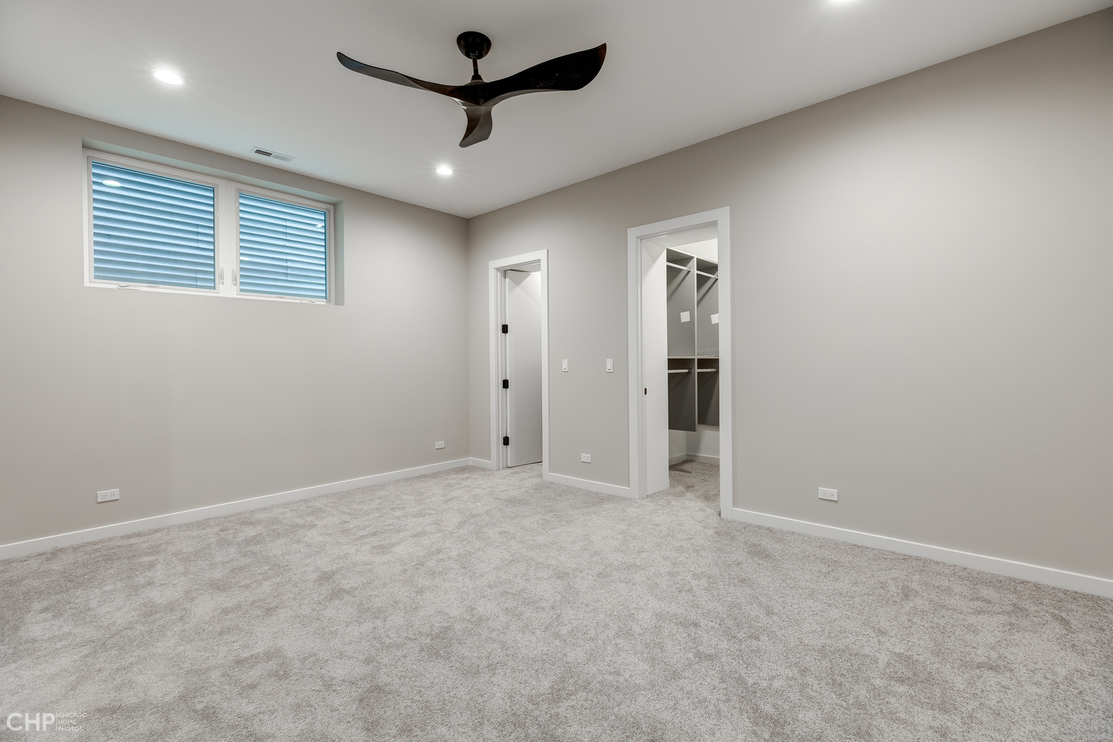 1729 North Artesian Avenue, Unit 1 Chicago, IL 60647 - Photo 12 of 17 an empty room with a ceiling fan and a window