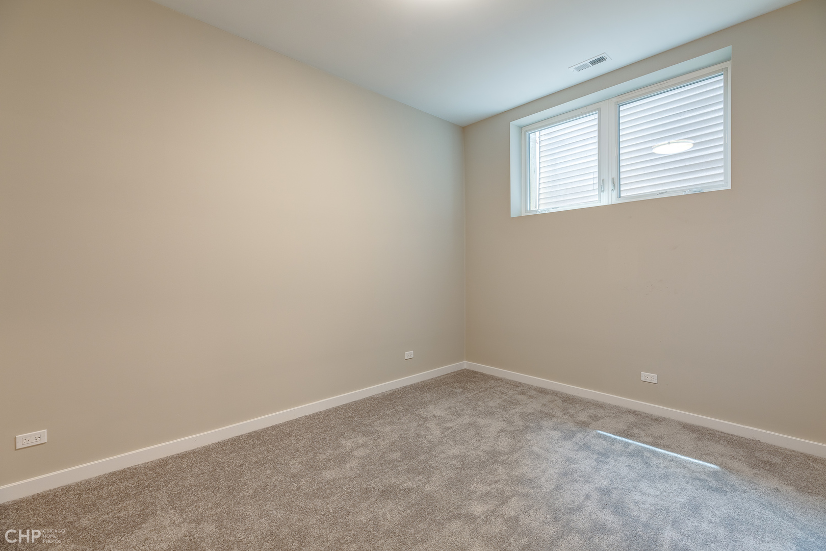 1729 North Artesian Avenue, Unit 1 Chicago, IL 60647 - Photo 13 of 17 an empty room with windows