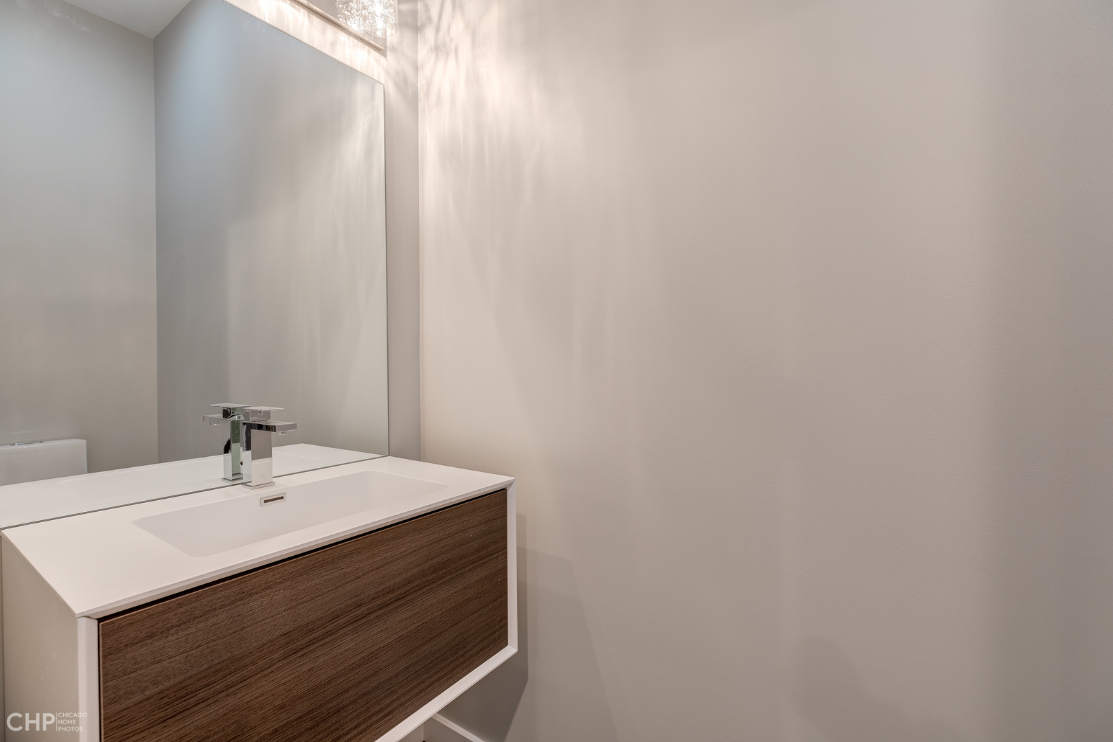 1729 North Artesian Avenue, Unit 1 Chicago, IL 60647 - Photo 5 of 17 a bathroom with a sink and a mirror