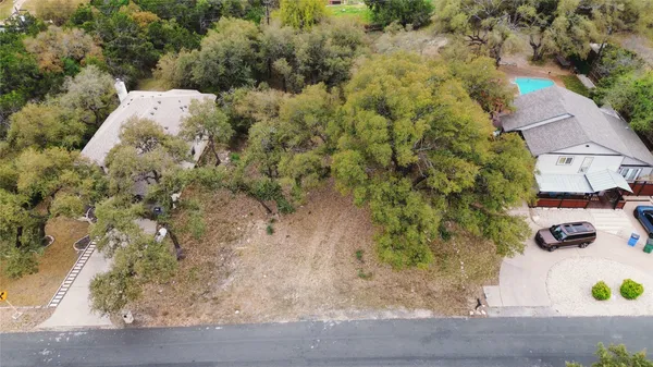 an aerial view of a houses with yard
