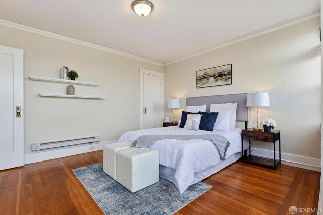 a spacious bedroom with a bed and a couch