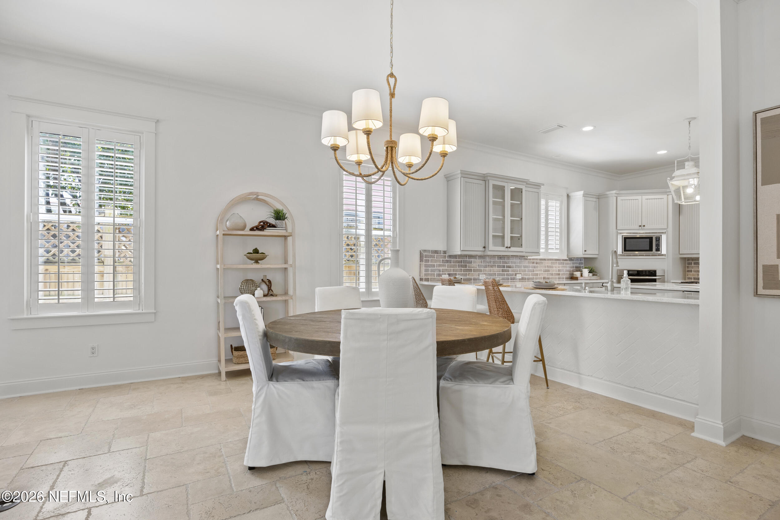 2912 Abaco Lane Jacksonville Beach, FL 32250 - Photo 11 of 46 a view of kitchen with dining area refrigerator and window