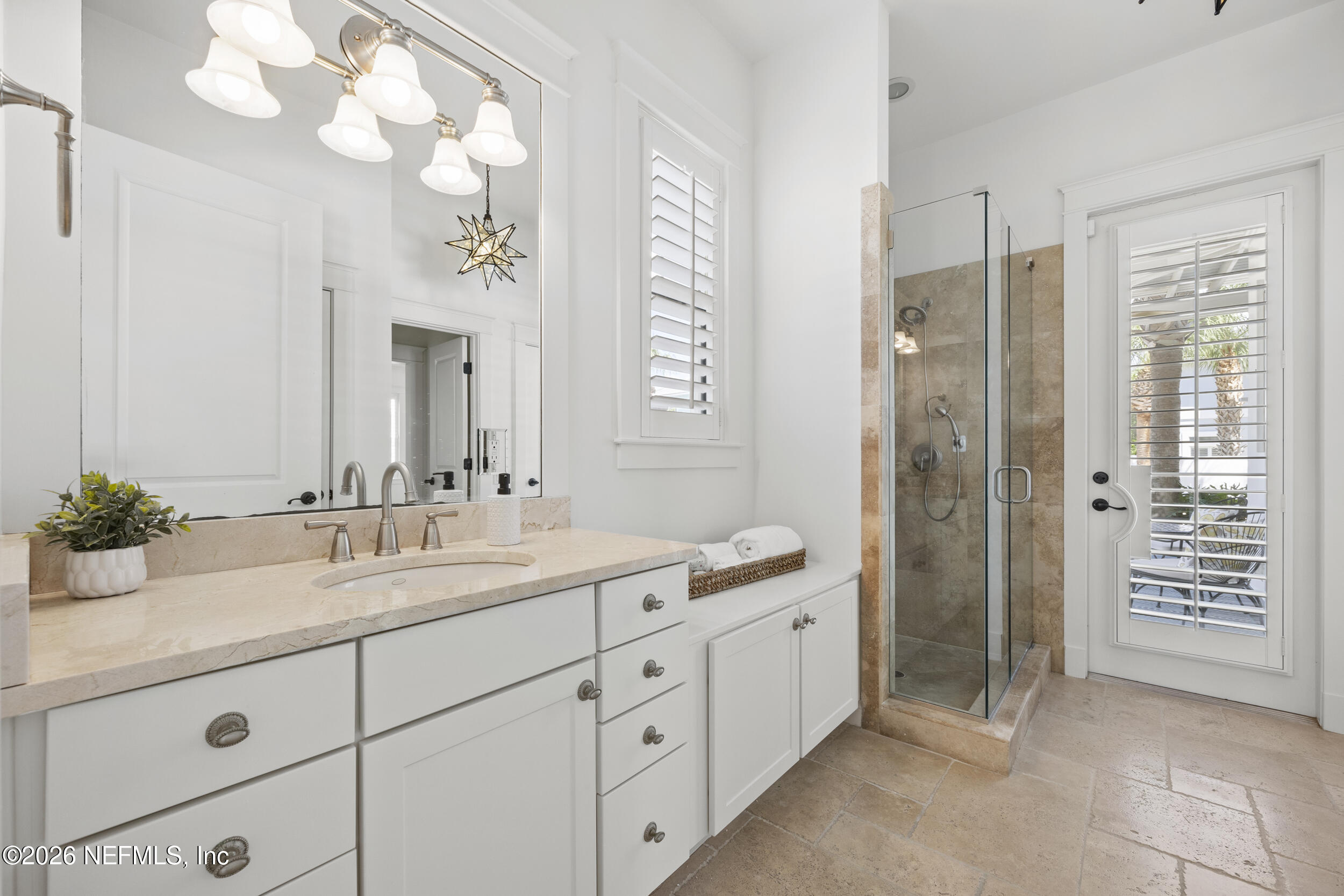 2912 Abaco Lane Jacksonville Beach, FL 32250 - Photo 21 of 46 a spacious en suite bathroom with a granite countertop sink mirror and shower
