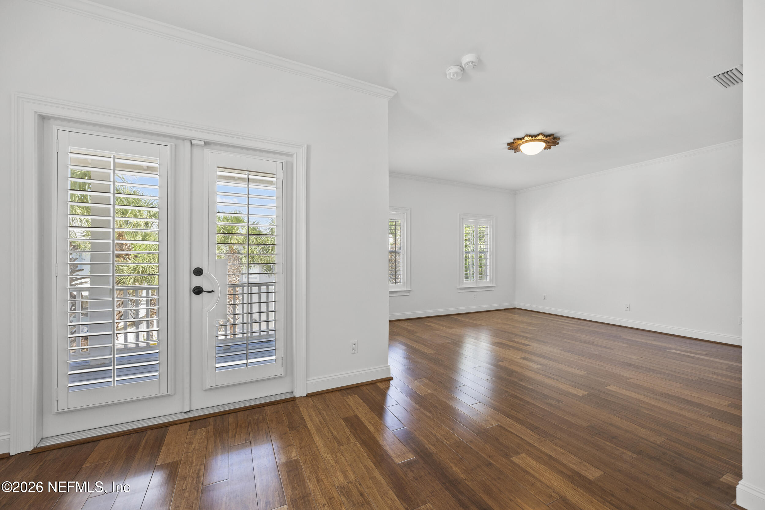2912 Abaco Lane Jacksonville Beach, FL 32250 - Photo 23 of 46 a view of wooden floor and windows in a room