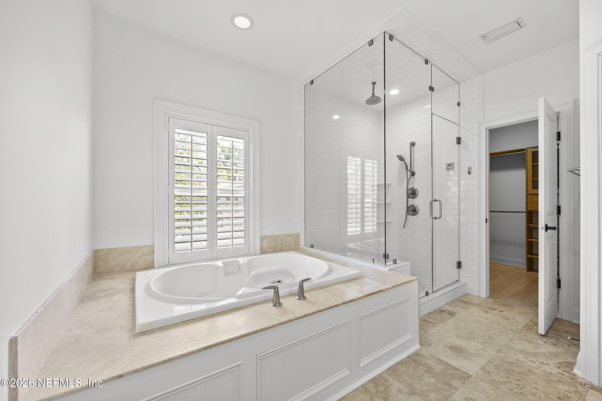 2912 Abaco Lane Jacksonville Beach, FL 32250 - Photo 26 of 46 a spacious bathroom with a granite countertop tub shower and mirror