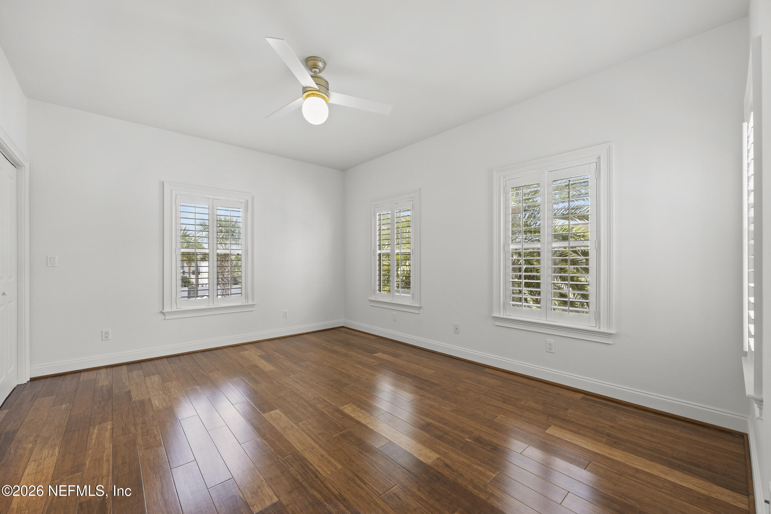 2912 Abaco Lane Jacksonville Beach, FL 32250 - Photo 31 of 46 a view of an empty room with wooden floor and a window