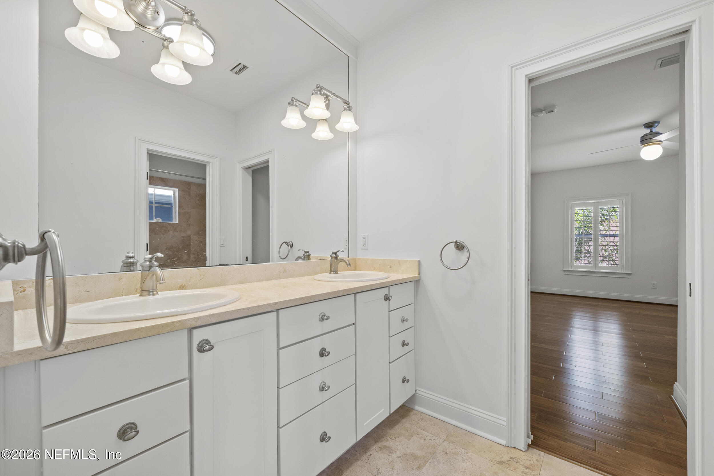 2912 Abaco Lane Jacksonville Beach, FL 32250 - Photo 33 of 46 a bathroom with a double vanity sink and a mirror