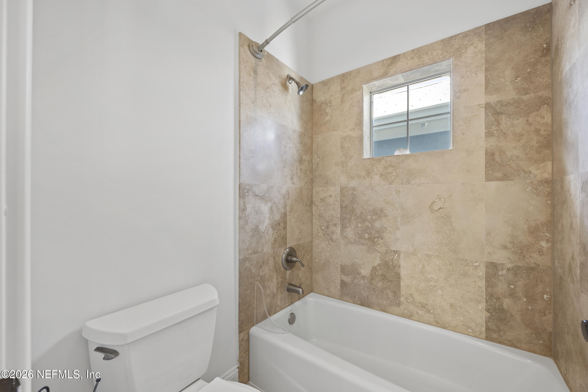 2912 Abaco Lane Jacksonville Beach, FL 32250 - Photo 34 of 46 a bathroom with a bathtub and a shower