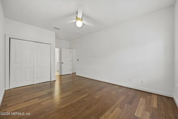 a view of a balcony with wooden floor