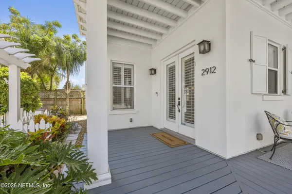 a view of outdoor space with wooden floor and plants