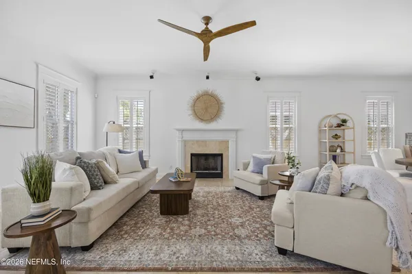 a living room with furniture and a fireplace
