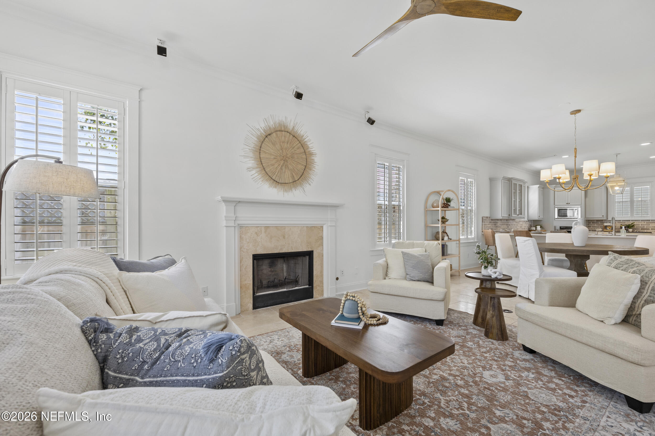 2912 Abaco Lane Jacksonville Beach, FL 32250 - Photo 6 of 46 a living room with furniture a fireplace and a large window