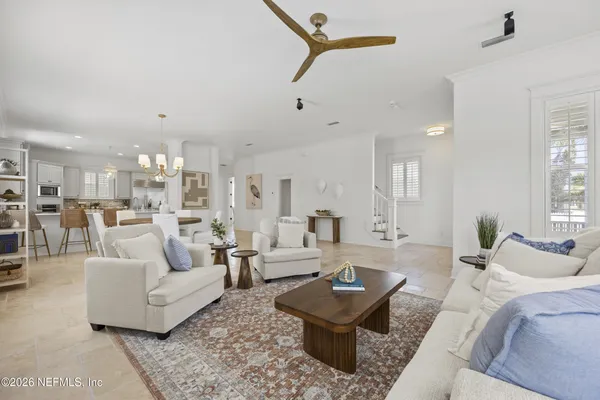 a living room with furniture and a table
