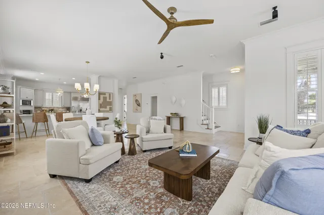 a living room with furniture and a table