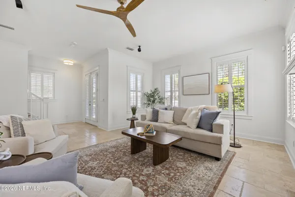 a living room with furniture and a rug