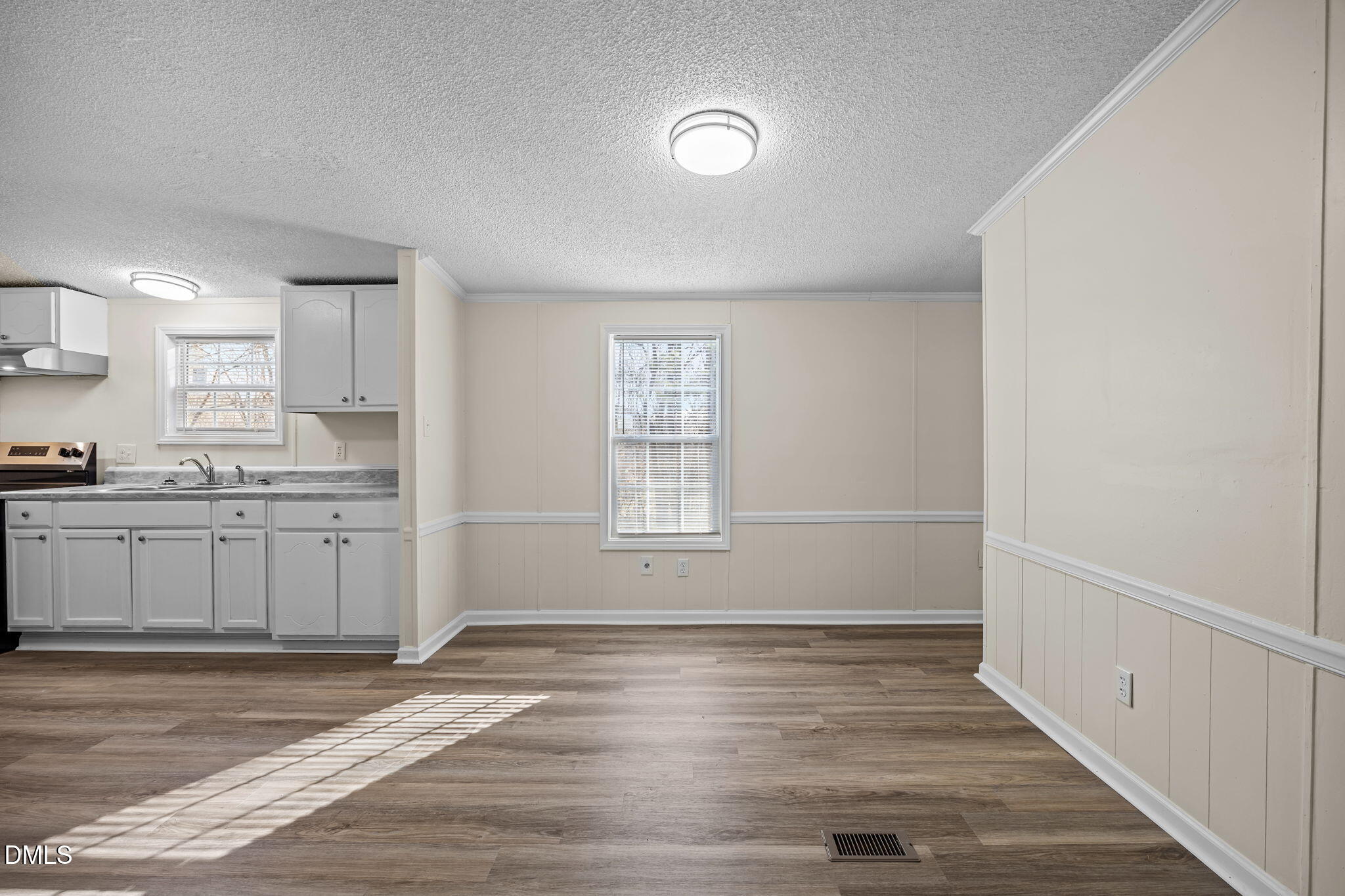 91 Pine Ridge Road Henderson, NC 27537 - Photo 18 of 50 a view of a kitchen with wooden floor and a window