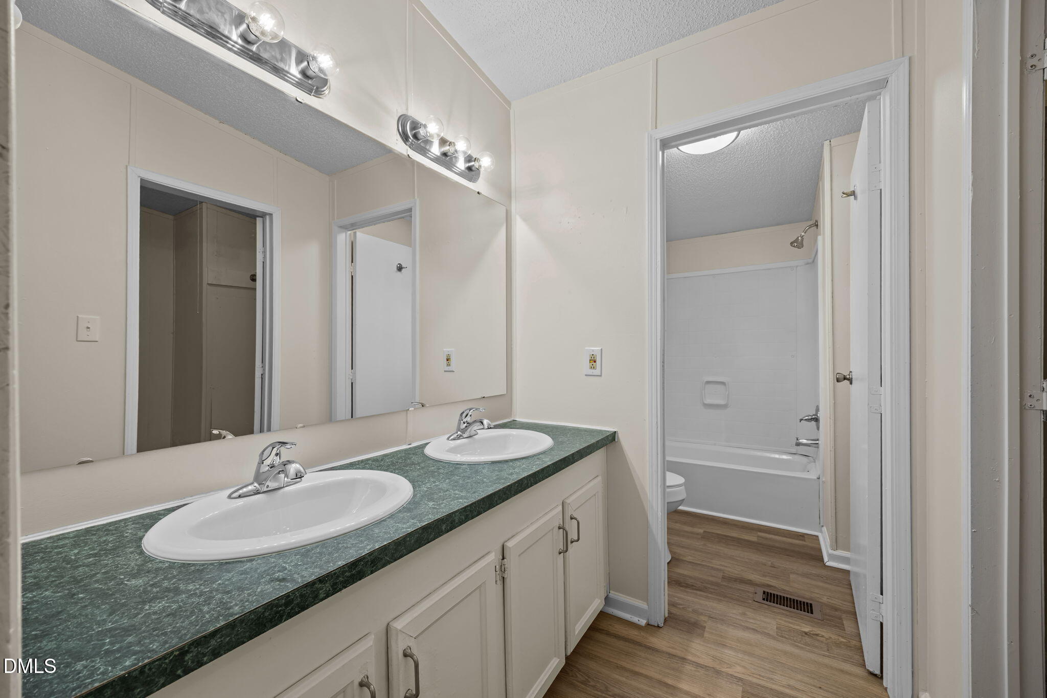 91 Pine Ridge Road Henderson, NC 27537 - Photo 27 of 50 a bathroom with a granite countertop double vanity sink and a mirror