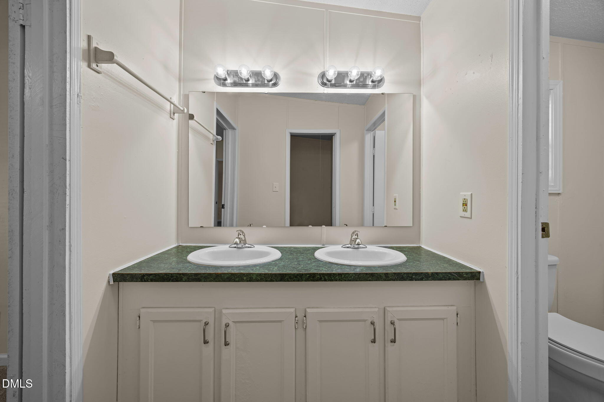 91 Pine Ridge Road Henderson, NC 27537 - Photo 28 of 50 a bathroom with a granite countertop sink and a mirror