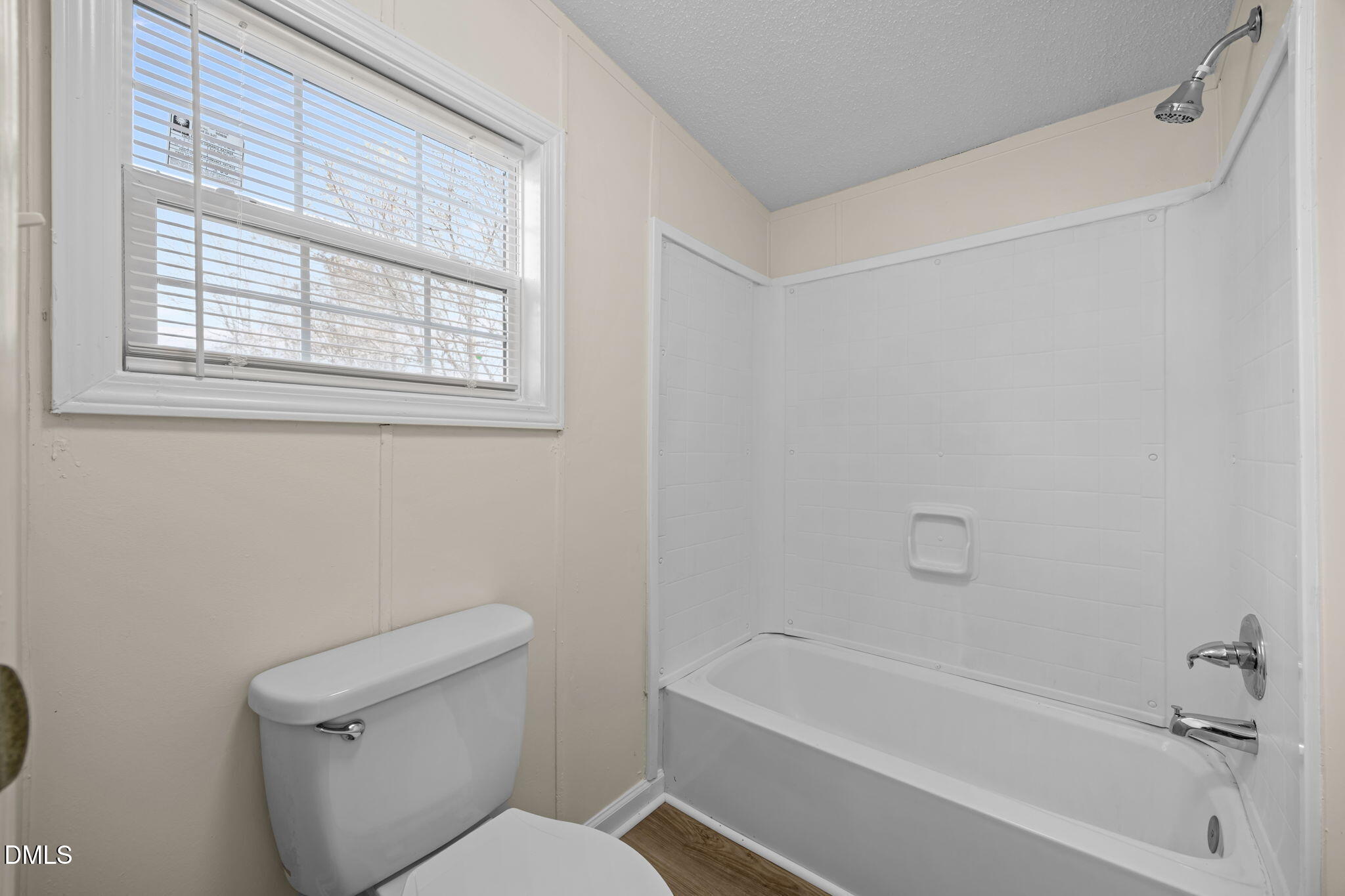 91 Pine Ridge Road Henderson, NC 27537 - Photo 29 of 50 a white bath tub sitting next to a white toilet