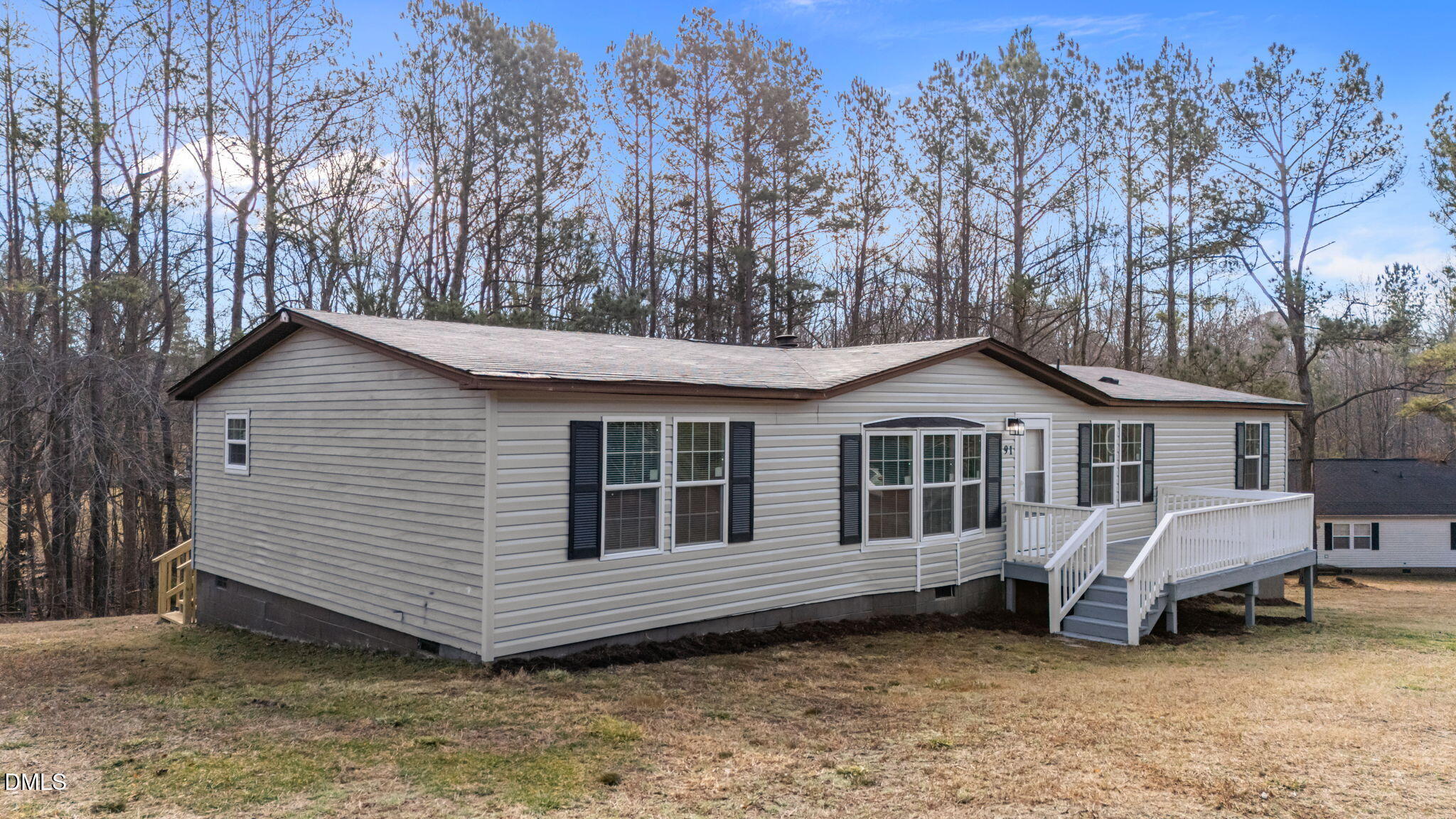 91 Pine Ridge Road Henderson, NC 27537 - Photo 3 of 50 a view of a house with a yard and sitting area
